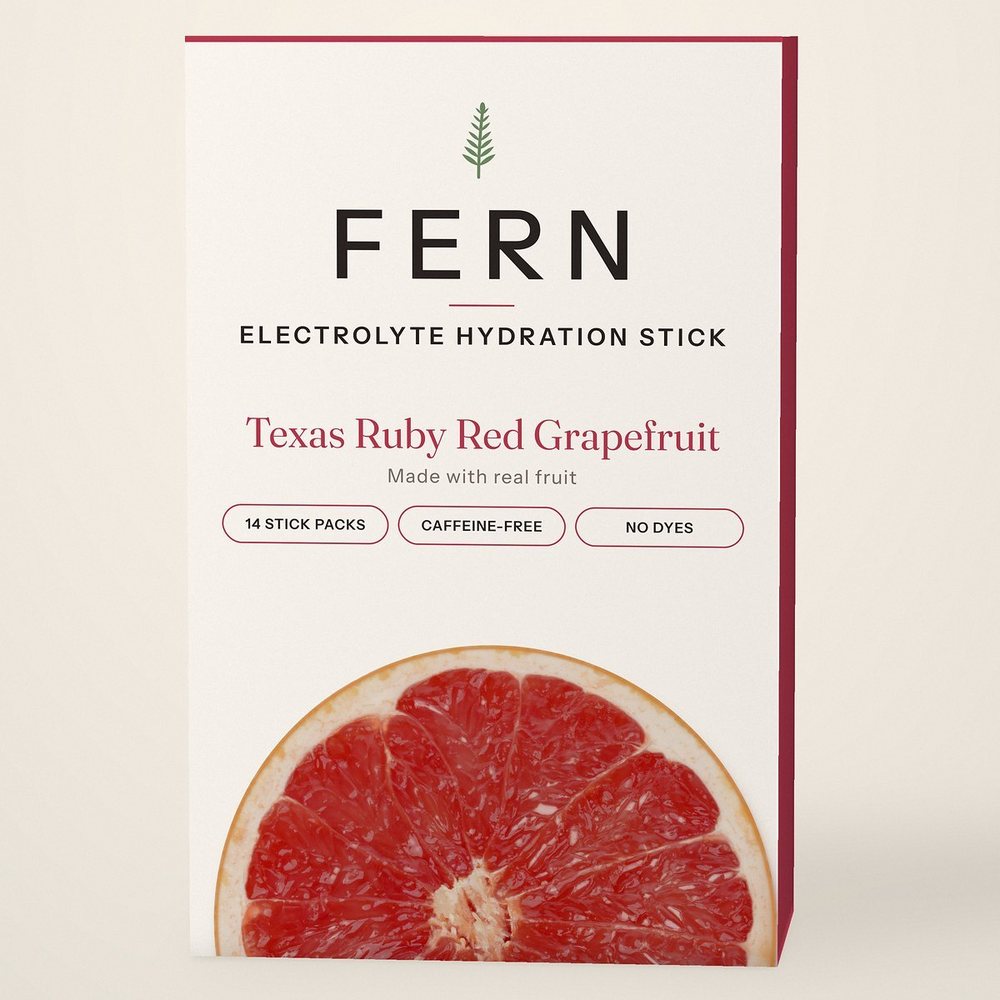 FERN Electrolyte Hydration Stick box in Texas Ruby Red Grapefruit, cream with a ruby edge and a grapefruit half